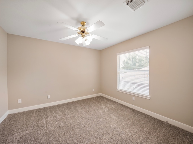 carpeted empty room featuring ceiling fan