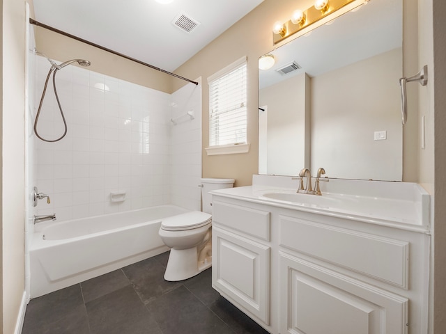 full bathroom with tile patterned floors, vanity, toilet, and tiled shower / bath combo