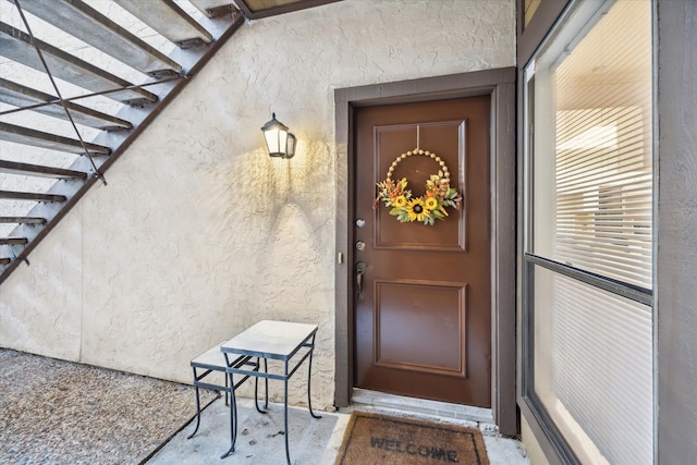 11711 Memorial Dr Unit 291, Houston, TX 77024 - doorway to property featuring stucco siding