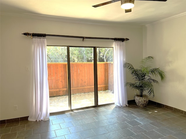 doorway with ceiling fan and ornamental molding