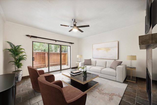 living room featuring ceiling fan and ornamental molding