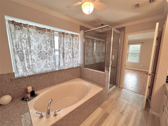 bathroom with crown molding, wood-type flooring, and shower with separate bathtub