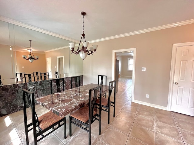 tiled dining room featuring ornamental molding and an inviting chandelier