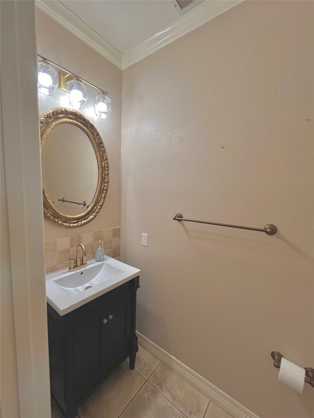 bathroom featuring tile patterned floors, vanity, ornamental molding, and backsplash