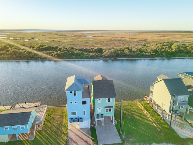 aerial view featuring a rural view and a water view