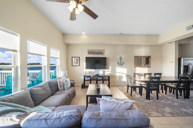 living room featuring ceiling fan and light tile patterned floors