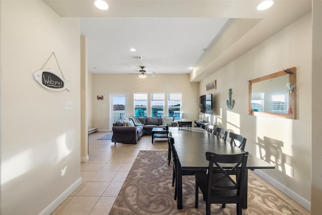 dining room with light tile patterned floors and ceiling fan