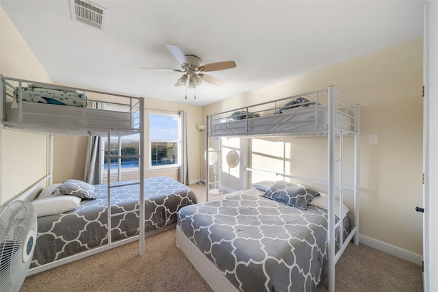 bedroom with ceiling fan and carpet floors