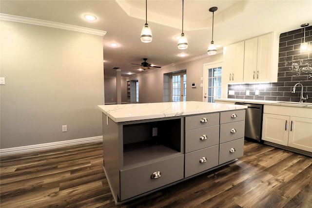 kitchen with sink, dishwasher, white cabinets, a center island, and dark hardwood / wood-style floors