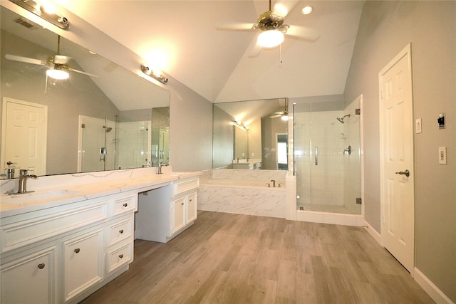 2304 Eagles Way, Pearland, TX 77581 - bathroom featuring a ceiling fan, lofted ceiling, a shower stall, a bath, and double vanity