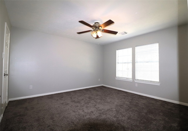 carpeted empty room featuring ceiling fan