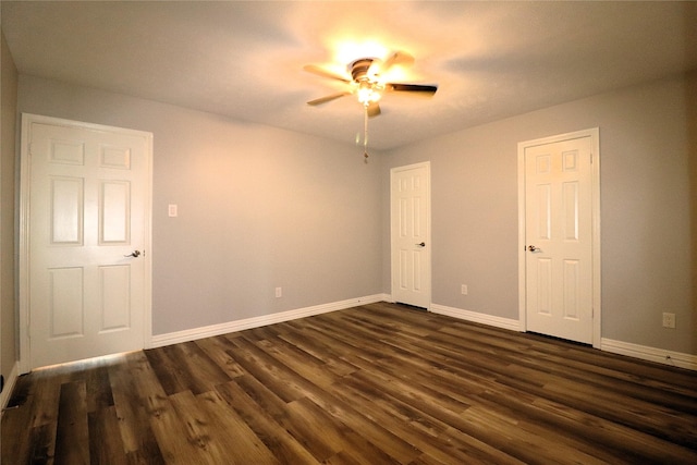 2304 Eagles Way, Pearland, TX 77581 - unfurnished bedroom with baseboards, dark wood-style flooring, and a ceiling fan