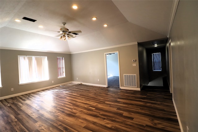 empty room with dark hardwood / wood-style floors, ceiling fan, ornamental molding, and lofted ceiling