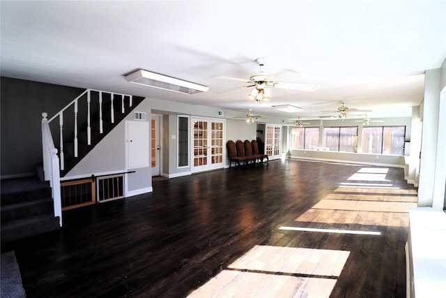 2304 Eagles Way, Pearland, TX 77581 - unfurnished living room featuring ceiling fan, stairway, wood finished floors, and baseboards
