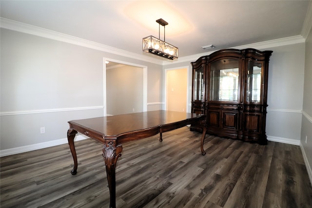 dining space featuring dark wood-type flooring and ornamental molding