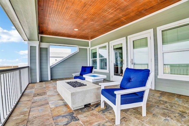 view of patio / terrace with a fire pit