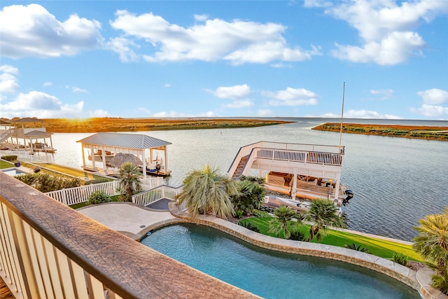 view of pool featuring a water view