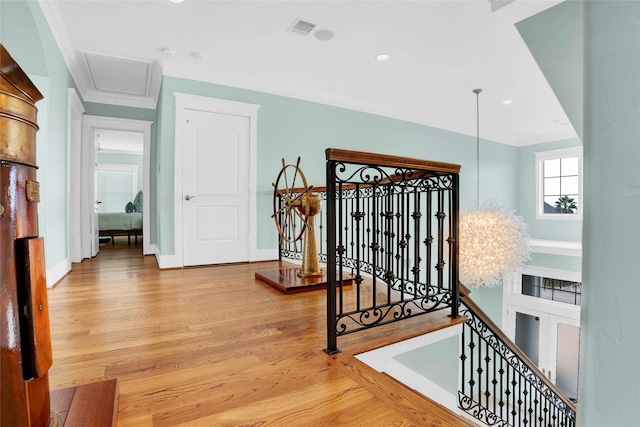 corridor featuring crown molding and wood-type flooring