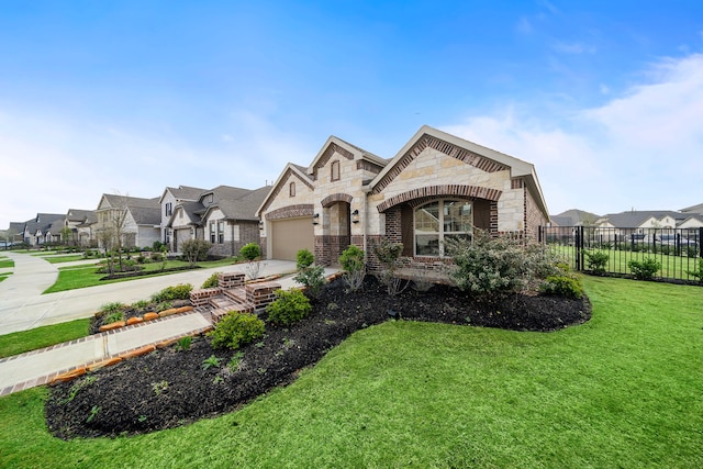 french country home with a front yard and a garage