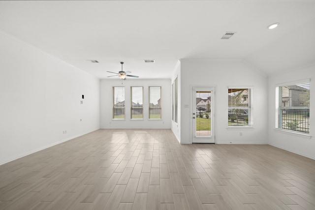 unfurnished living room featuring ceiling fan, light wood-type flooring, and a wealth of natural light