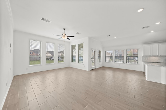 unfurnished living room with ceiling fan and light hardwood / wood-style floors