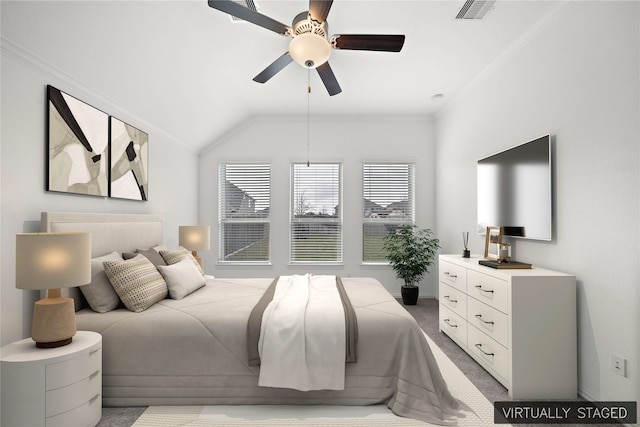 carpeted bedroom with ceiling fan, ornamental molding, and vaulted ceiling