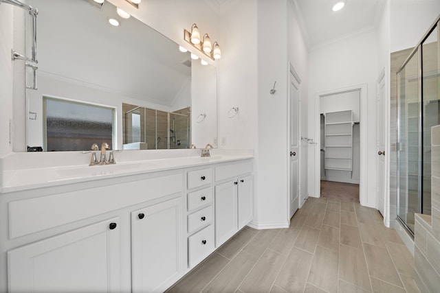 bathroom featuring vanity, walk in shower, and lofted ceiling