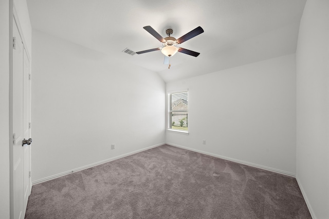 carpeted spare room with vaulted ceiling and ceiling fan