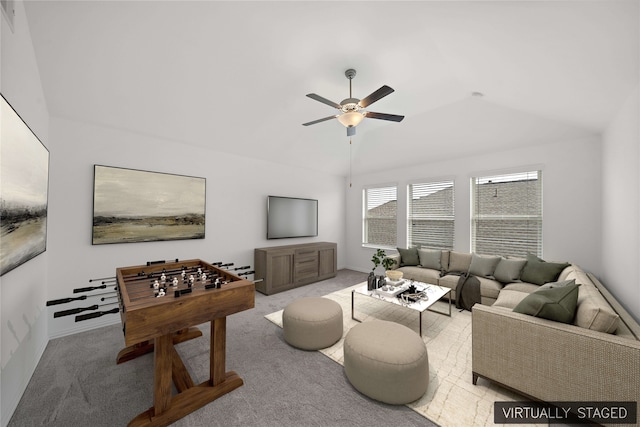 living room with light carpet, ceiling fan, and vaulted ceiling