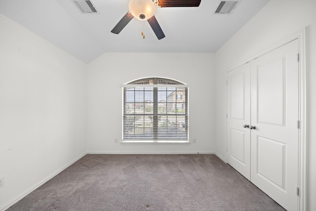 unfurnished room with carpet flooring, ceiling fan, and lofted ceiling