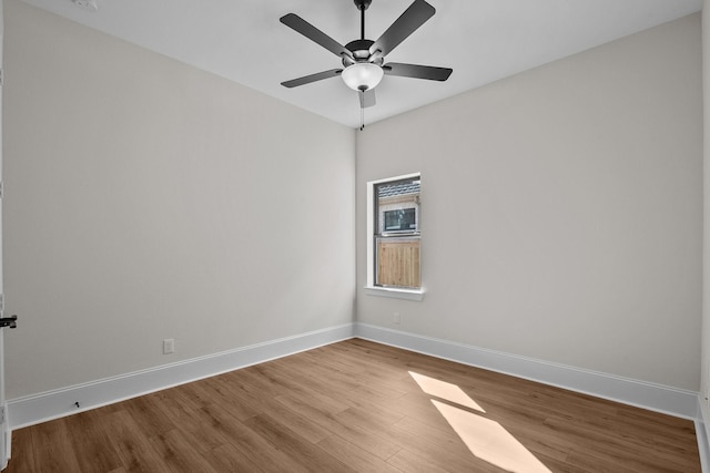 empty room featuring hardwood / wood-style floors and ceiling fan