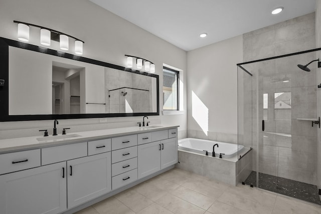 bathroom featuring vanity, tile patterned flooring, and plus walk in shower