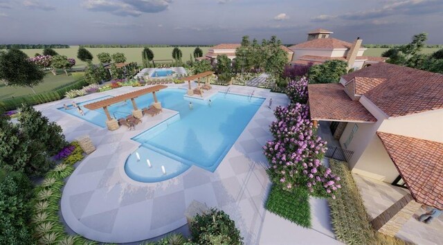 view of swimming pool with a patio and a rural view