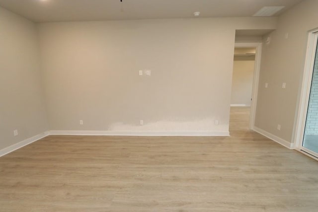 spare room featuring light wood-type flooring