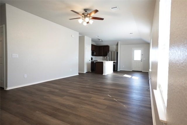 unfurnished living room with dark hardwood / wood-style flooring, ceiling fan, and lofted ceiling