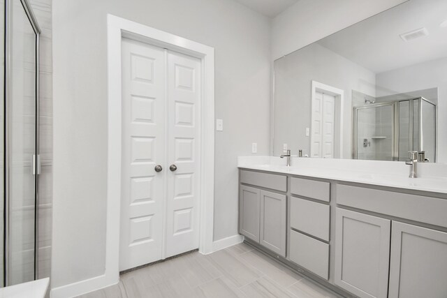 bathroom featuring vanity and walk in shower