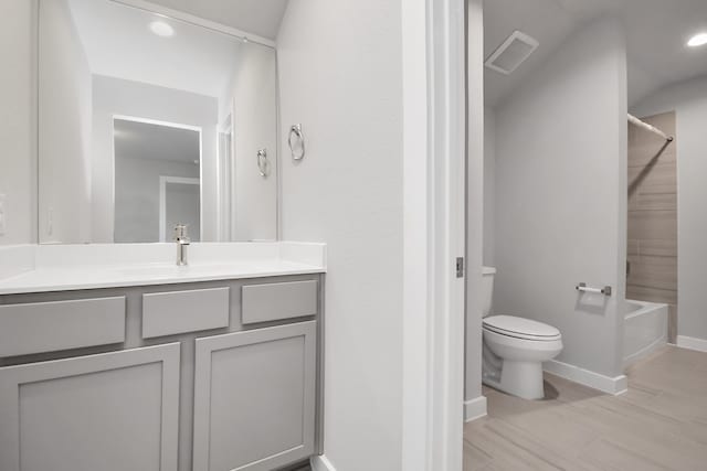 full bathroom featuring vanity, shower / bathtub combination, toilet, and wood-type flooring