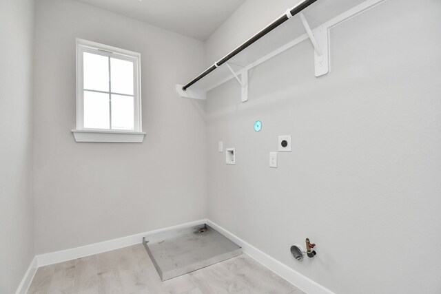 washroom with electric dryer hookup, gas dryer hookup, washer hookup, and light wood-type flooring