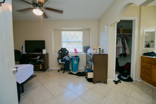 tiled home office with ceiling fan