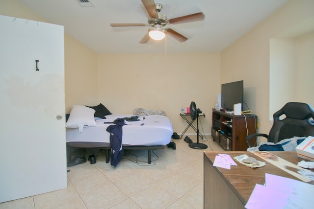 tiled bedroom featuring ceiling fan