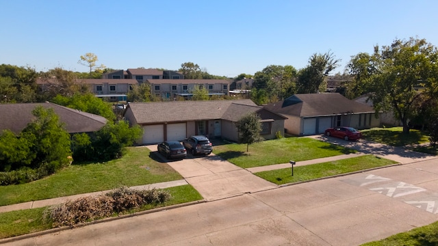 view of front facade with a front yard and a garage