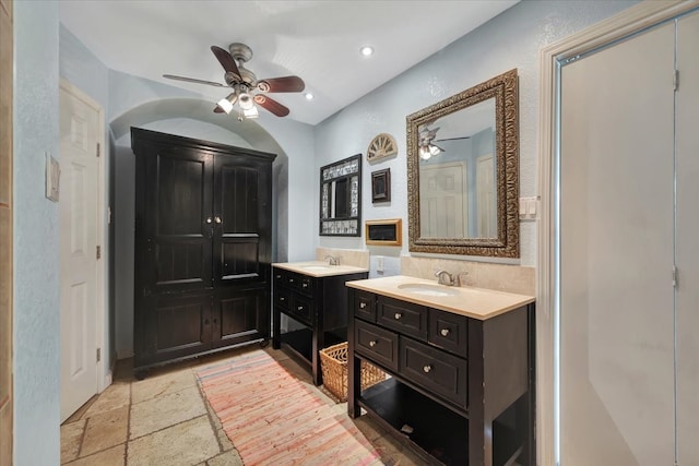 bathroom featuring ceiling fan and vanity