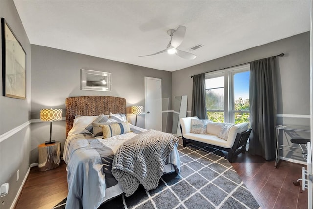 bedroom featuring ceiling fan and dark wood-type flooring