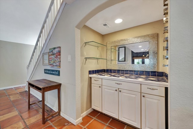 bathroom featuring backsplash and vanity