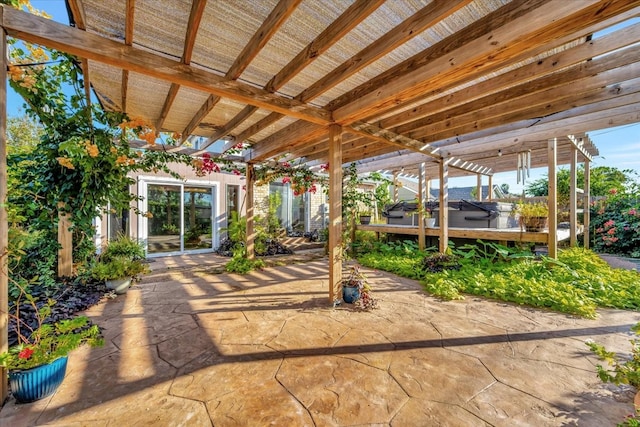 view of patio with a pergola and a jacuzzi