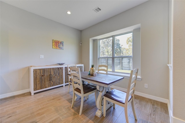 dining room with light wood-type flooring