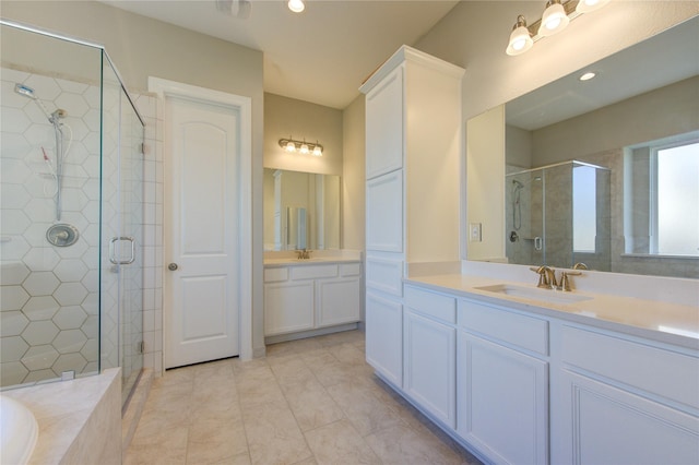 bathroom with shower with separate bathtub, tile patterned floors, and vanity