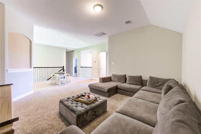 living room featuring carpet and lofted ceiling