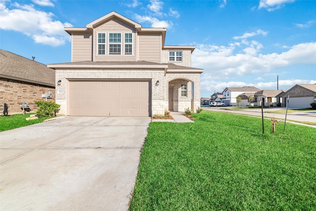 view of property with a front yard and a garage