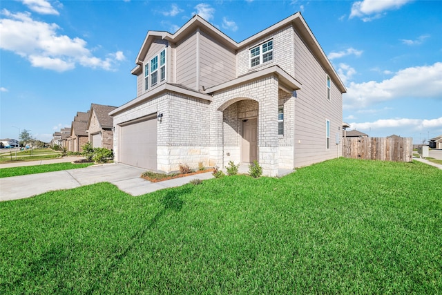 view of front facade with a garage and a front lawn